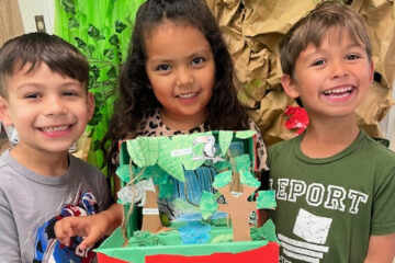 Three students with their diorama