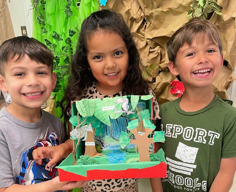 Three students with their diorama