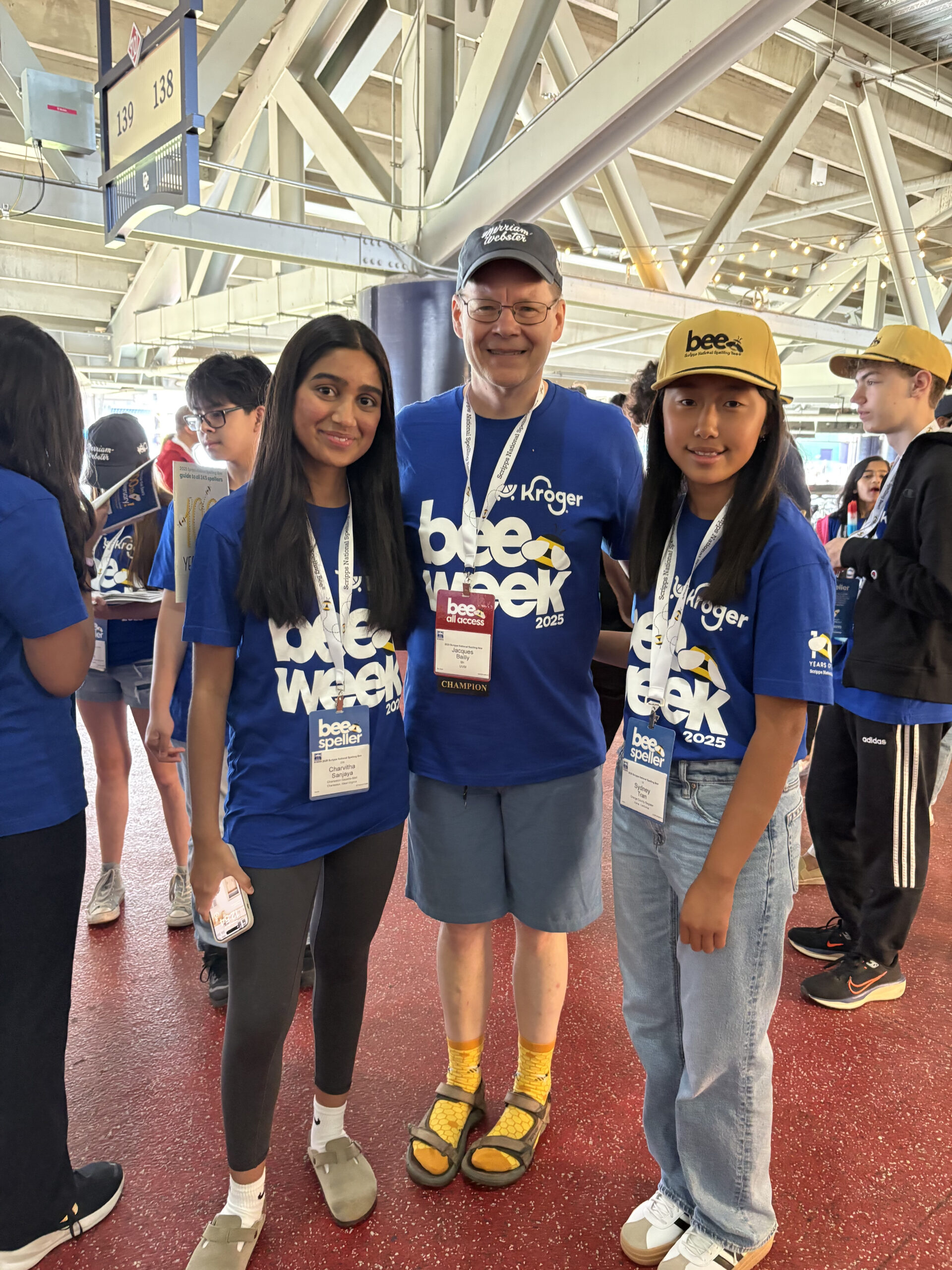 Orange County student Sydney Tran, pictured right, meets longtime lead Scripps Bee pronouncer Dr. Jacques Bailly and a fellow competitor at the Memorial Day picnic at Nationals Park in Washington, D.C.